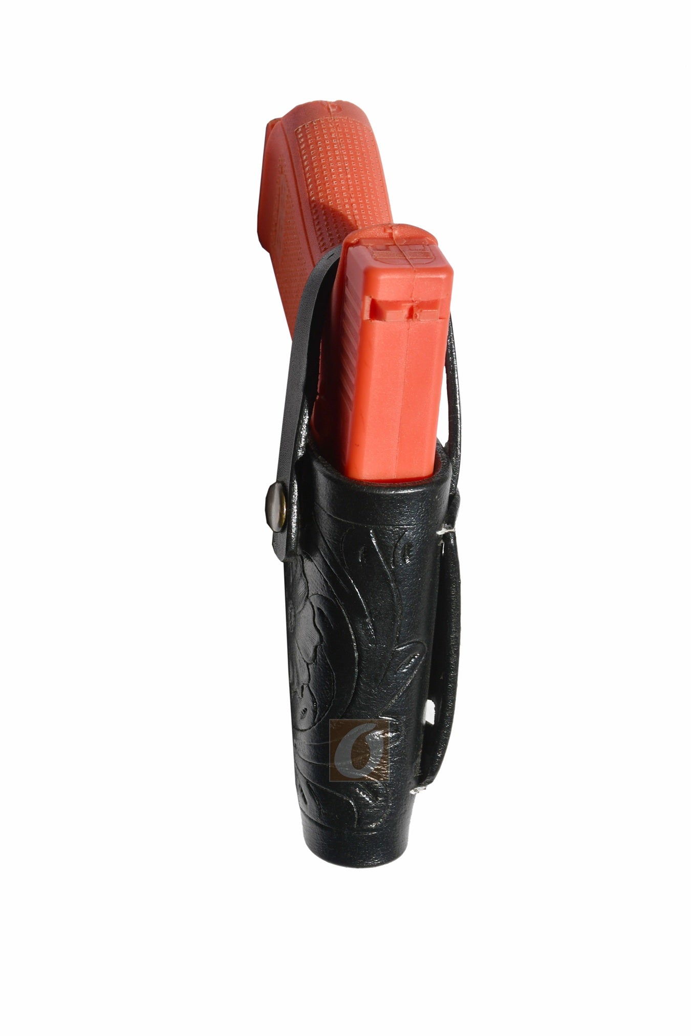 Angled view of black leather Glock holster, right handed, featuring floral tooling for enhanced durability and comfort