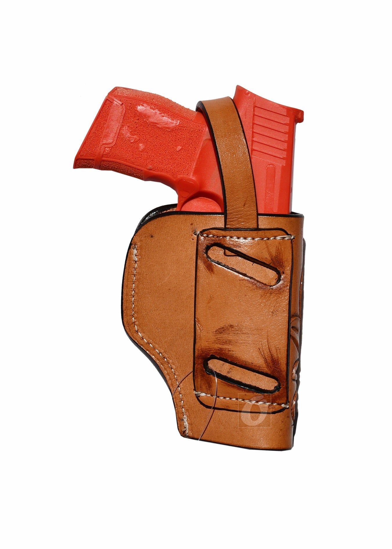 Back view of tan leather Glock holster, left handed, showing the strong leather construction and retention features for concealed carry