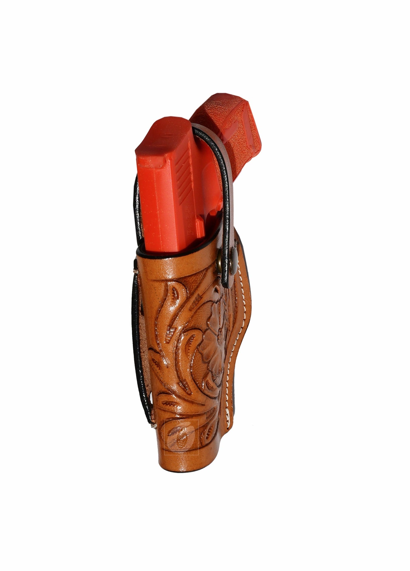 Angled view of tan leather Glock holster, left handed, showcasing the floral tooling and comfortable fit for concealed carry