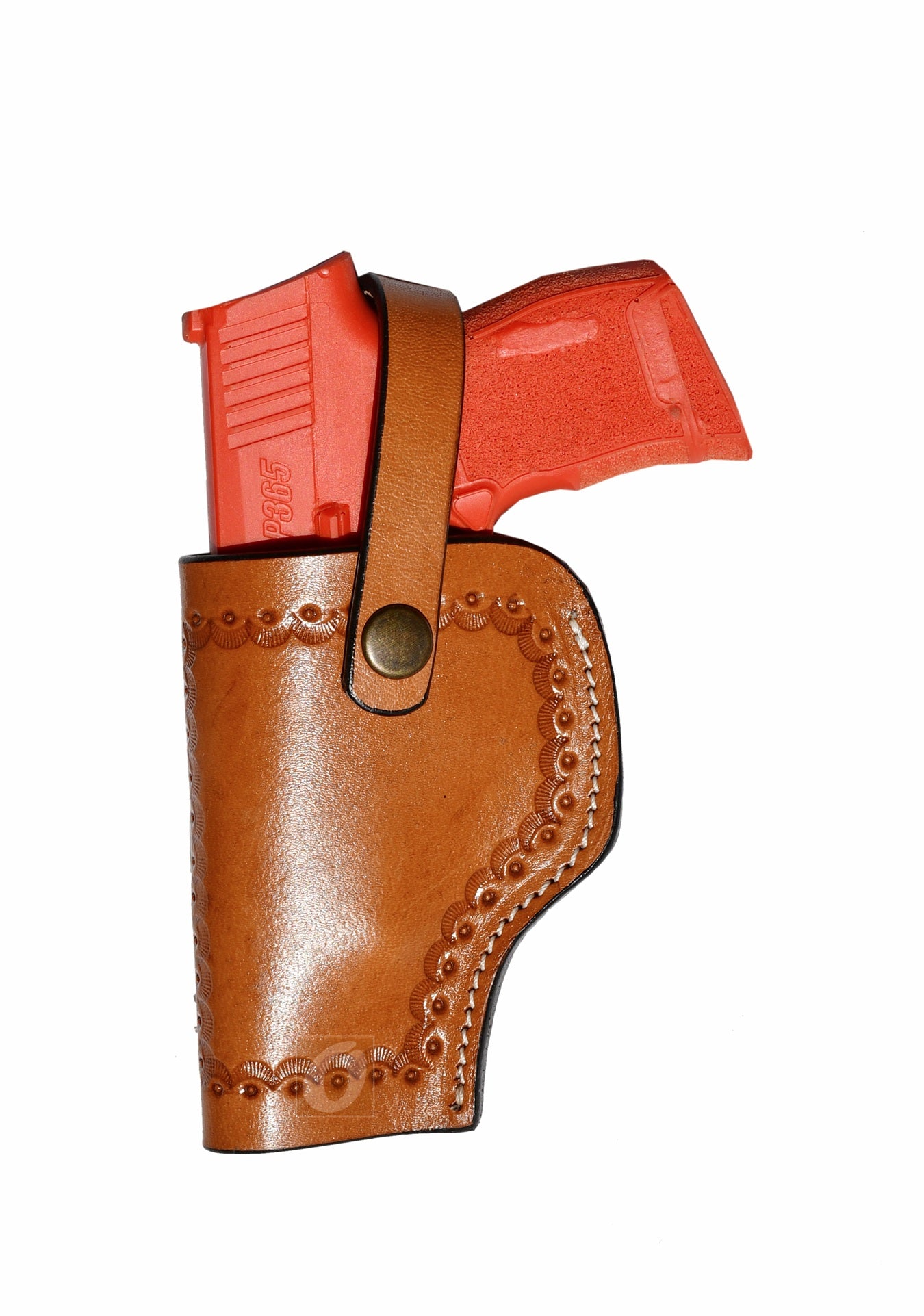 Tan leather Glock holster, left handed, with sea shell tooling for a custom, durable concealed carry holster