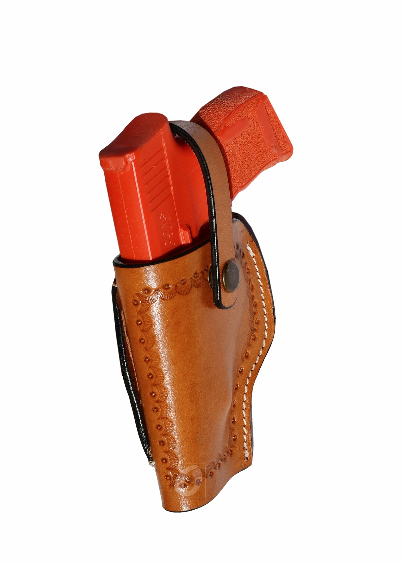 Side view of tan leather Glock holster, left handed, showcasing fine sea shell tooling and secure fit for concealed carry