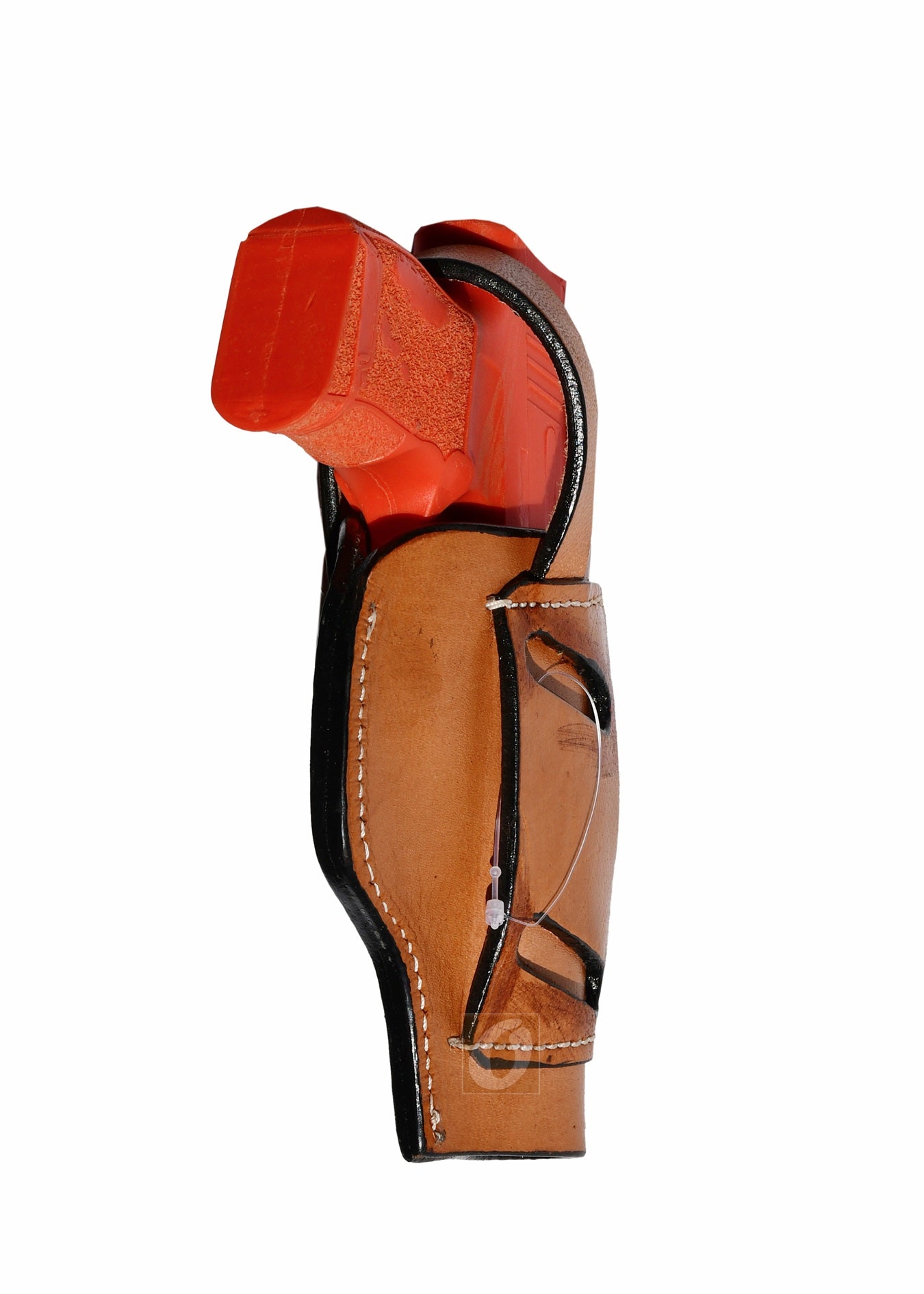 Angled view of tan leather Glock holster, left handed, with sea shell tooling for enhanced comfort and stylish design