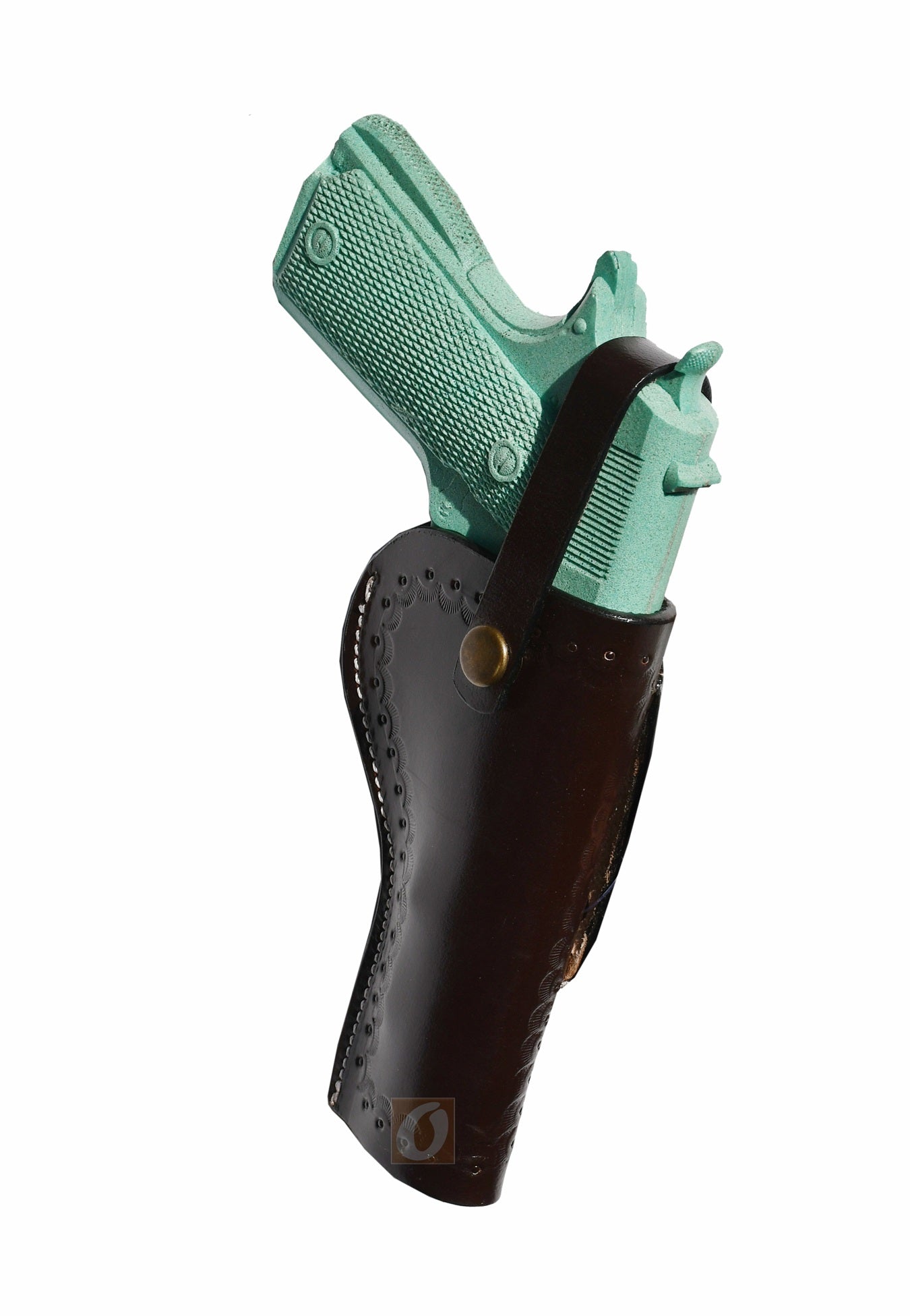 Side profile of a handmade leather 1911 holster, featuring deep sea shell engraving and a snug firearm fit.