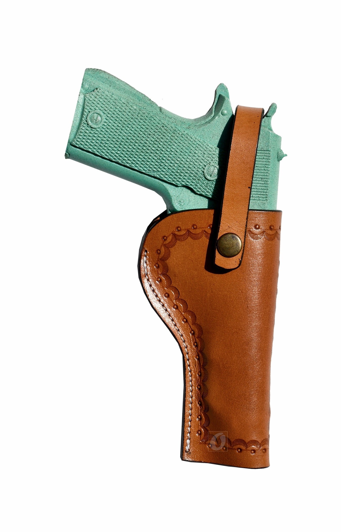 Right-handed tan 1911 holster in full-grain leather, featuring hand-tooled sea shell patterns for a rugged, Western aesthetic.