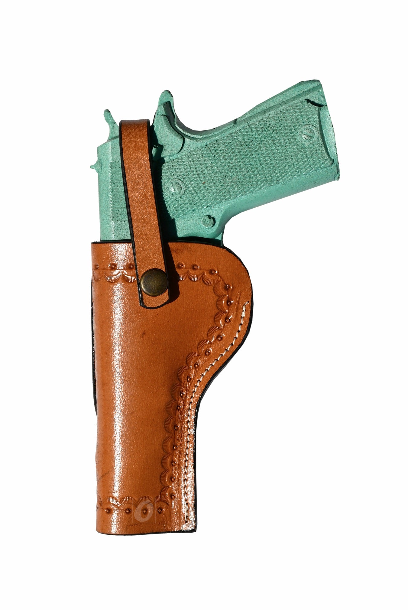 Left-handed tan sea shell tooled leather holster for 1911, perfect for OWB carry, cowboy action shooting, or everyday open carry.
