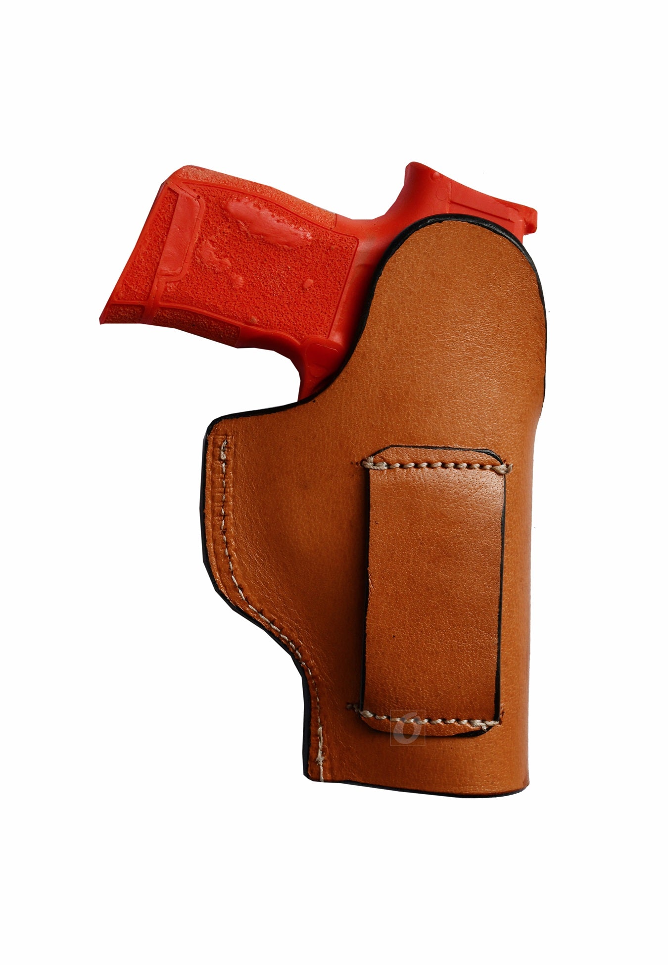 Western-style left-handed tan leather holster with seashell tooling, custom-made for Sig P365. A durable, high-quality leather holster that offers both elegance and functionality for daily use.