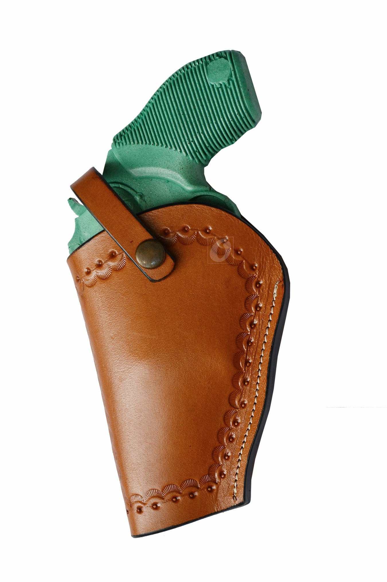 Left-handed tan leather holster with intricate seashell tooling – a handcrafted Western-style gun holster designed for durability and a unique coastal-inspired look.