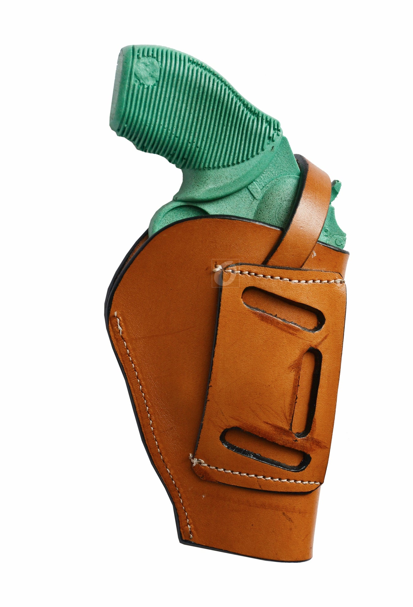 Premium tan leather gun holster with seashell tooling, crafted for left-handed shooters. A perfect blend of Western aesthetics and secure firearm carry.