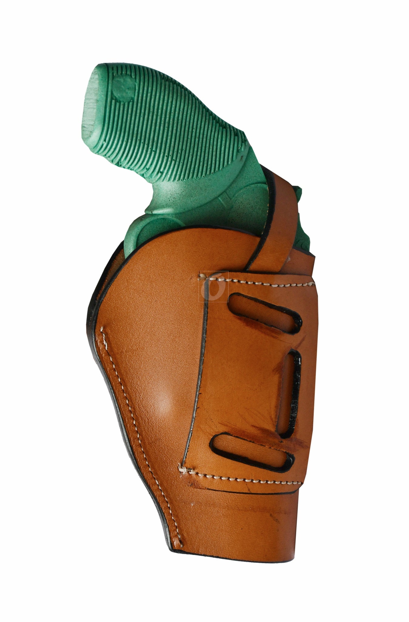 Western-style left-handed tan leather holster featuring detailed seashell tooling. A high-quality, durable holster designed for revolver enthusiasts who appreciate fine craftsmanship.