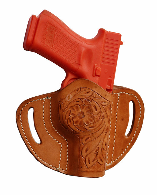 A beautifully handcrafted right-handed leather holster with intricate floral tooling. This Glock holster is designed for a secure and stylish fit, compatible with Glock 17 holster, Glock 19 holster, and other popular models.