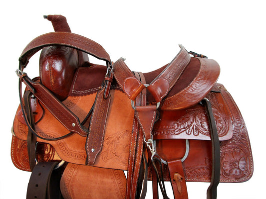 Brown leather horse saddle with intricate designs on a white background